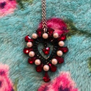 Betsey Johnson necklace with red and black stones with pearls.
